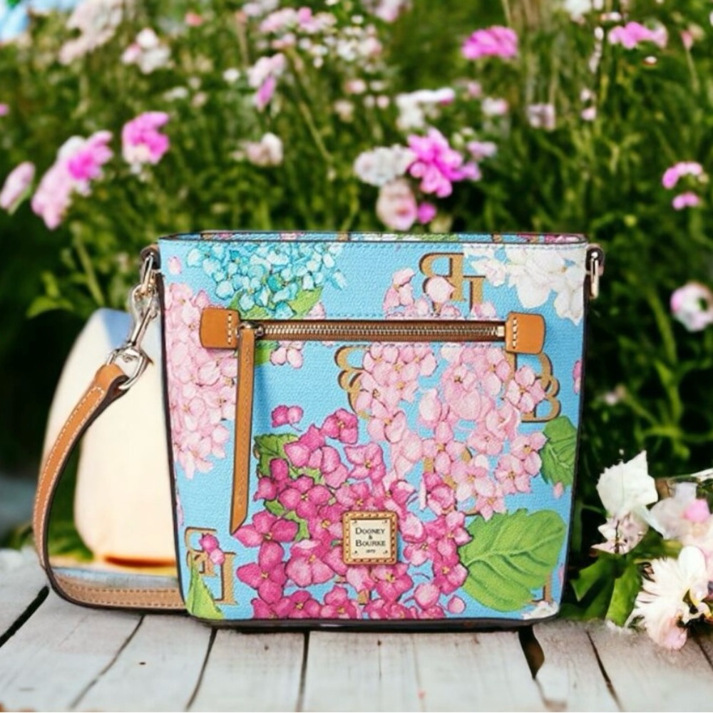 New. Never used Dooney & Bourke Hydrangea Monogram Zip Crossbody